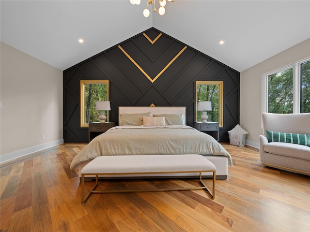 5 N Hills Rd, East Norwich, NY 11732 - bedroom with baseboards, lofted ceiling, light wood finished floors, a decorative wall, and an accent wall