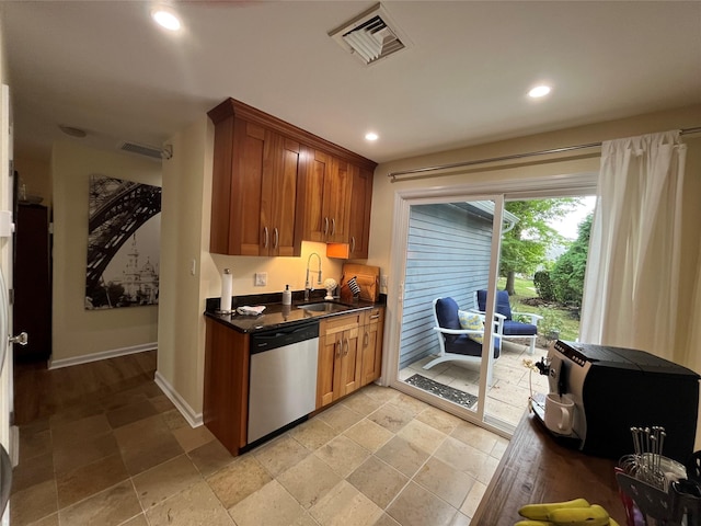 140A Laurance Ln, Ridge, NY 11961 - kitchen featuring stainless steel dishwasher, a sink, dark countertops, stone tile flooring, and recessed lighting