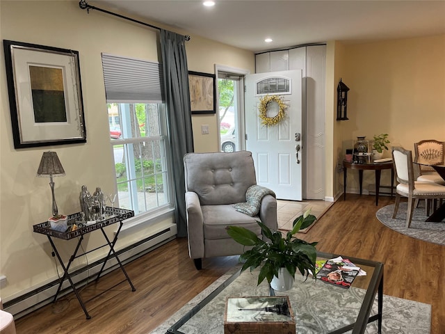 140A Laurance Ln, Ridge, NY 11961 - living room with baseboard heating, wood finished floors, a baseboard radiator, and recessed lighting