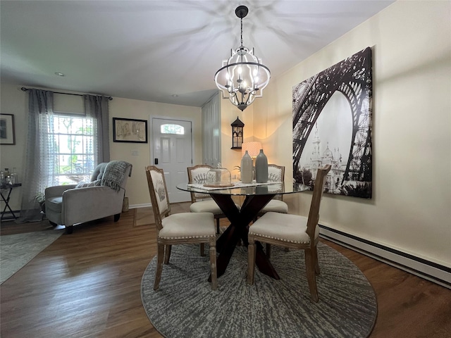 140A Laurance Ln, Ridge, NY 11961 - dining area with wood finished floors, a chandelier, and baseboards
