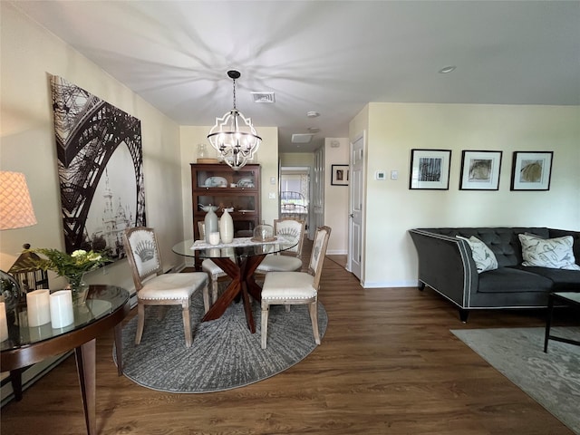 140A Laurance Ln, Ridge, NY 11961 - dining area with a chandelier, wood finished floors, and baseboards