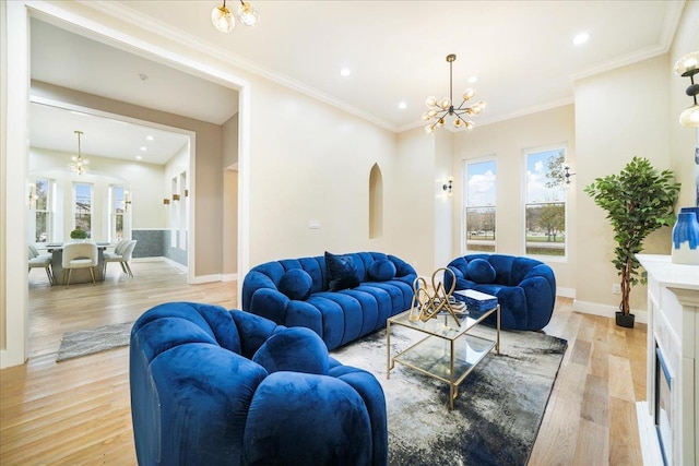 260 Main St, Goshen, NY 10924 - living area featuring arched walkways, recessed lighting, a notable chandelier, and light wood-type flooring