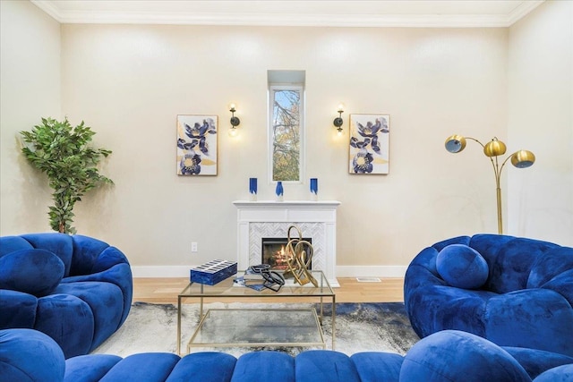 260 Main St, Goshen, NY 10924 - living area featuring a fireplace, crown molding, baseboards, and wood finished floors