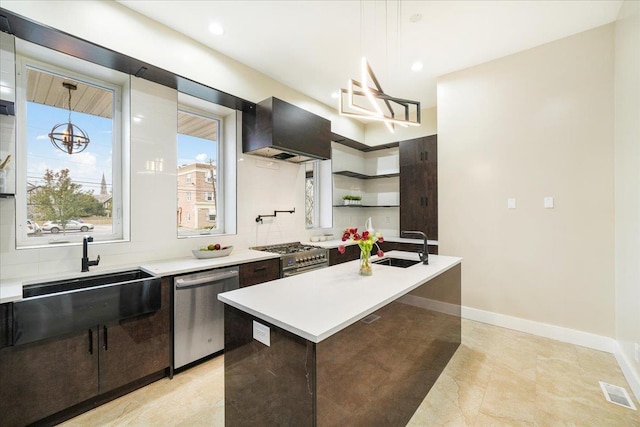 260 Main St, Goshen, NY 10924 - kitchen featuring dark brown cabinets, a sink, wall chimney exhaust hood, stainless steel appliances, and light countertops