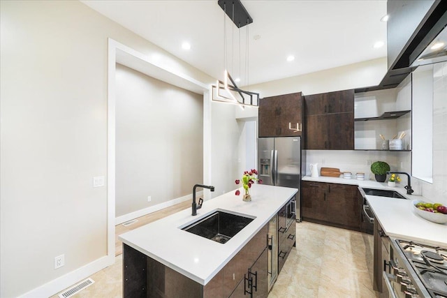 260 Main St, Goshen, NY 10924 - kitchen featuring open shelves, stainless steel appliances, visible vents, and a sink