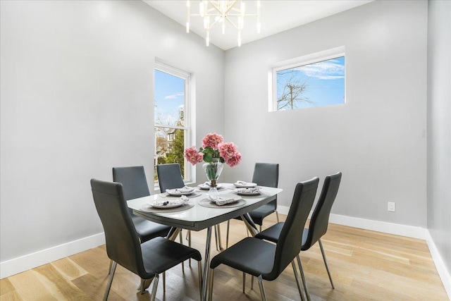 260 Main St, Goshen, NY 10924 - dining room with light wood finished floors, a chandelier, and baseboards