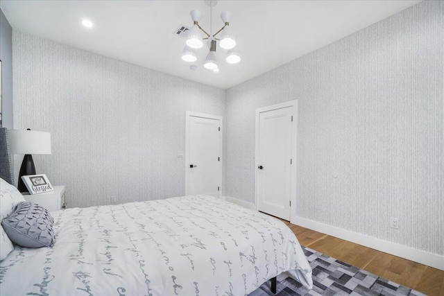 260 Main St, Goshen, NY 10924 - bedroom with a chandelier, baseboards, visible vents, and wood finished floors