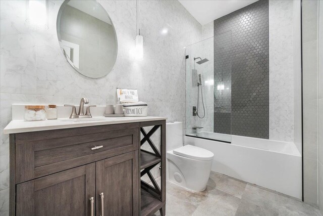 260 Main St, Goshen, NY 10924 - full bathroom featuring tile walls, toilet, shower / bathing tub combination, and vanity
