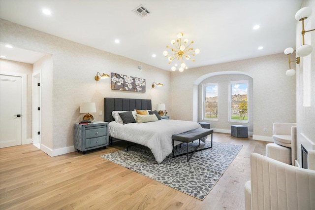 260 Main St, Goshen, NY 10924 - bedroom with a notable chandelier, baseboards, light wood-type flooring, and visible vents