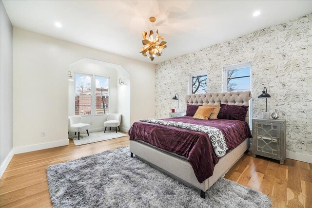 260 Main St, Goshen, NY 10924 - bedroom with wallpapered walls, wood finished floors, and baseboards