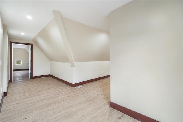 260 Main St, Goshen, NY 10924 - additional living space with lofted ceiling, recessed lighting, baseboards, visible vents, and light wood-style floors