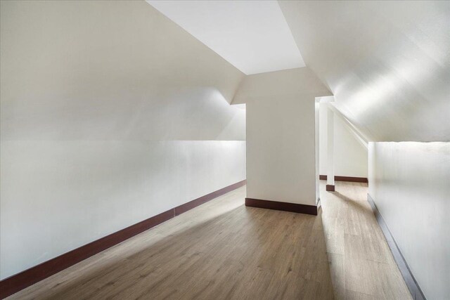 260 Main St, Goshen, NY 10924 - bonus room featuring lofted ceiling, baseboards, and wood finished floors