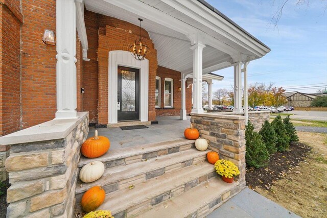 260 Main St, Goshen, NY 10924 - property entrance with a porch and brick siding