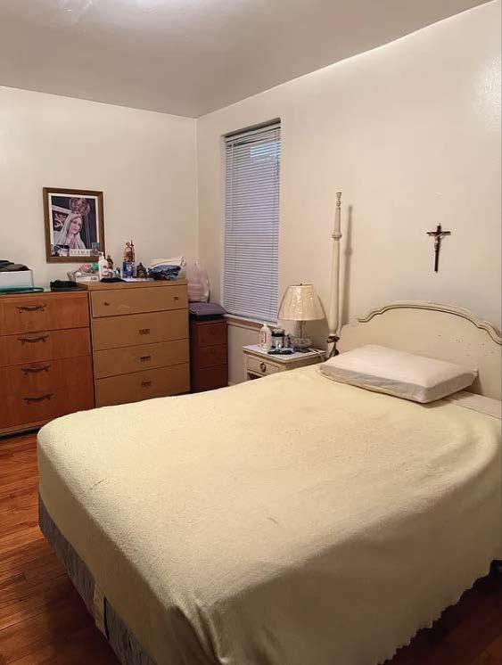 bedroom with wood finished floors