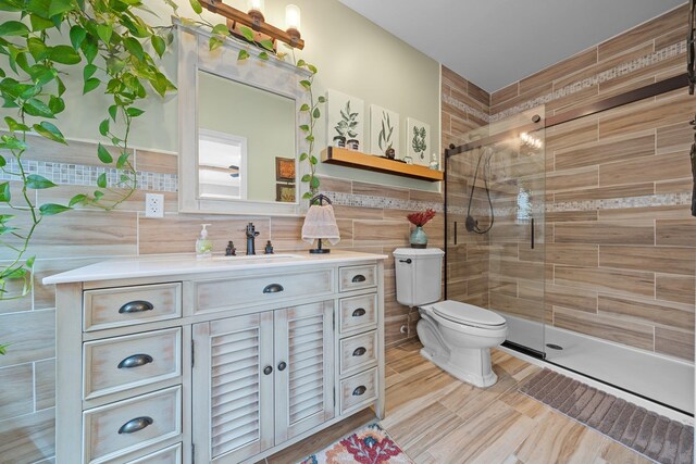 142 Rte 25a, Shoreham, NY 11786 - full bathroom with tile walls, tiled shower, toilet, and vanity