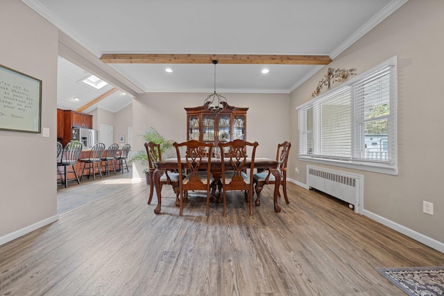 142 Rte 25a, Shoreham, NY 11786 - dining room with radiator heating unit, baseboards, light wood finished floors, recessed lighting, and ornamental molding