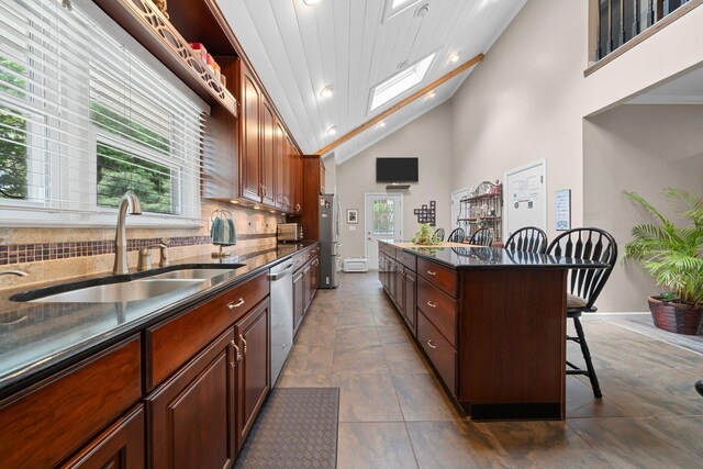 142 Rte 25a, Shoreham, NY 11786 - kitchen with a sink, a kitchen breakfast bar, stainless steel appliances, backsplash, and recessed lighting