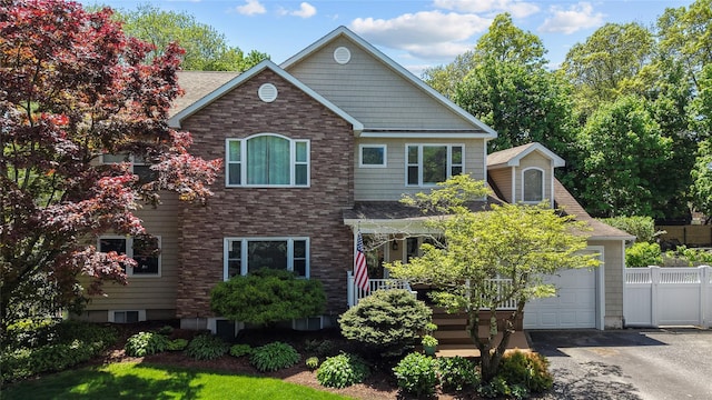 142 Rte 25a, Shoreham, NY 11786 - traditional home featuring a garage, fence, asphalt driveway, and a shingled roof