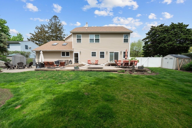 142 Rte 25a, Shoreham, NY 11786 - rear view of property with a shed, an outdoor structure, and a deck