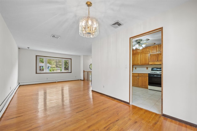 unfurnished living room with light wood-type flooring, a baseboard radiator, baseboard heating, and visible vents