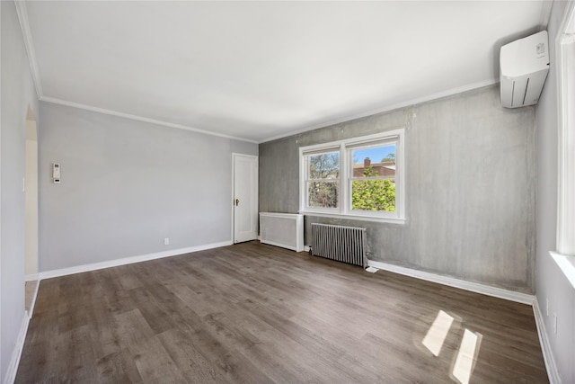 43-28 196th St, Flushing, NY 11358 - unfurnished room featuring baseboards, a wall mounted AC, radiator heating unit, and wood finished floors