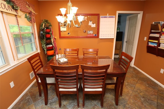 8 Rolling Way, New City, NY 10956 - dining space with stone tile floors, baseboards, and a chandelier