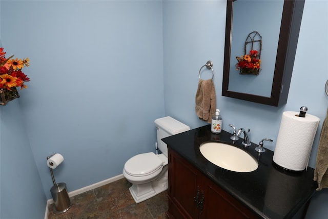 8 Rolling Way, New City, NY 10956 - half bath with toilet, baseboards, vanity, and stone finish floor