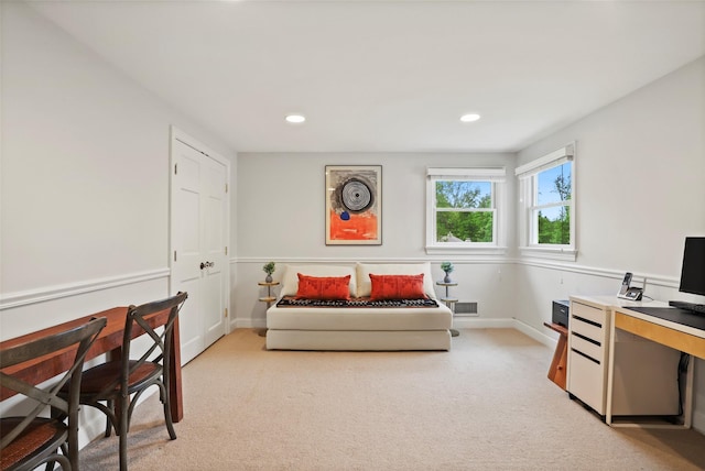 bedroom with light carpet, recessed lighting, baseboards, and a desk