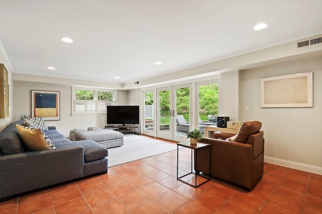 living area with tile patterned flooring, recessed lighting, baseboards, and crown molding