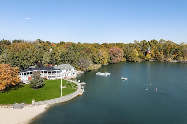 view from above of property featuring a forest and a large body of water