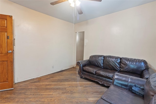 living area with ceiling fan and wood finished floors