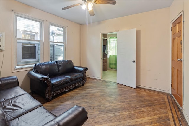 living room with a ceiling fan and wood finished floors