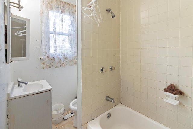 bathroom featuring vanity, shower / bathing tub combination, and toilet