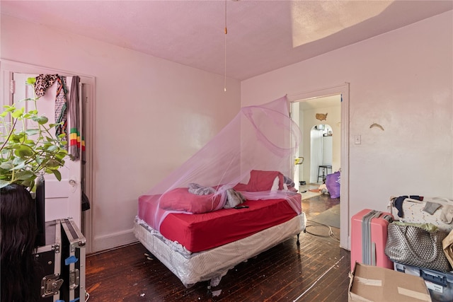 bedroom with wood-type flooring