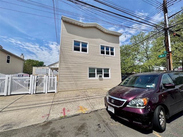 view of property exterior with fence