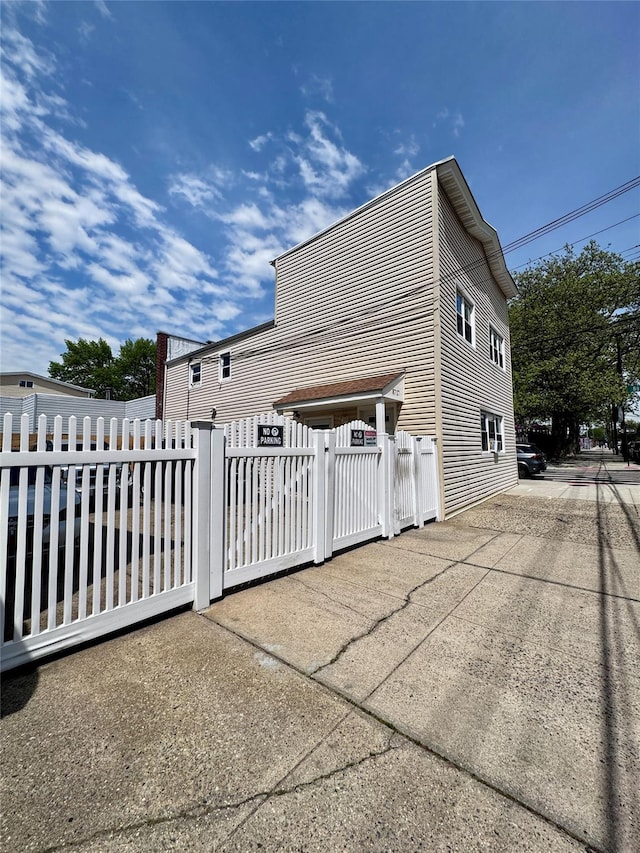 view of property exterior with fence private yard