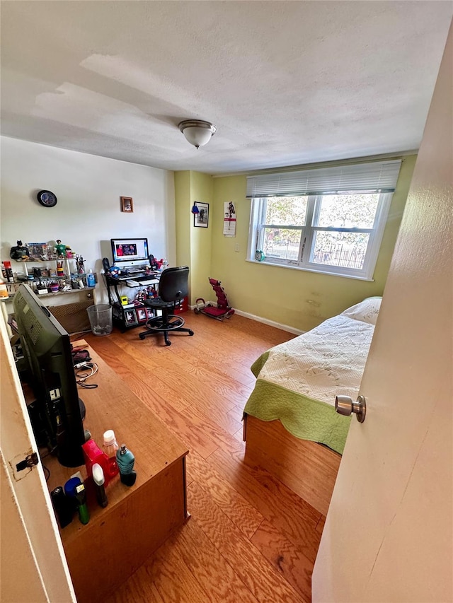 bedroom with wood finished floors