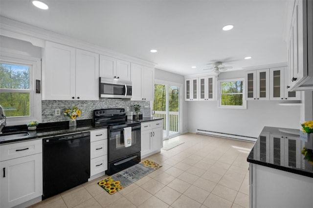 kitchen featuring a baseboard radiator, black appliances, ceiling fan, and white cabinetry