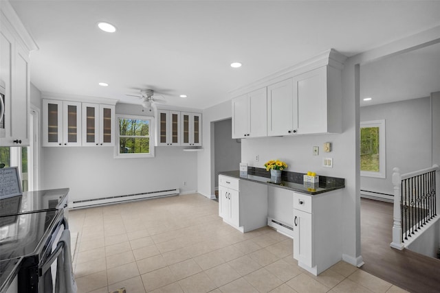 kitchen featuring plenty of natural light, a baseboard radiator, and a baseboard heating unit