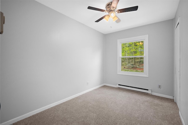 carpeted spare room featuring baseboards, ceiling fan, and baseboard heating