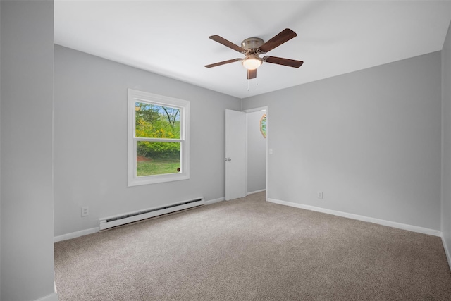 empty room with baseboards, ceiling fan, a baseboard heating unit, and carpet flooring