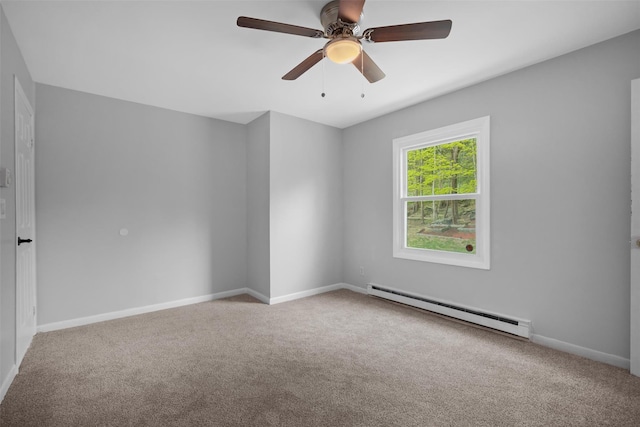 unfurnished room with a ceiling fan, baseboards, baseboard heating, and carpet flooring