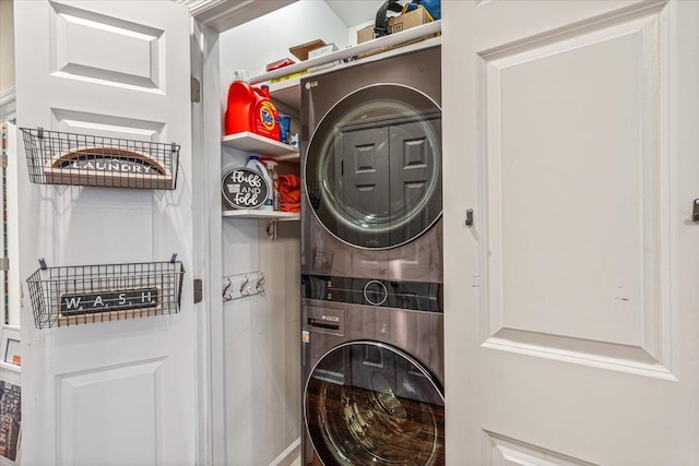 washroom with stacked washer / dryer