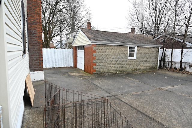 detached garage with fence