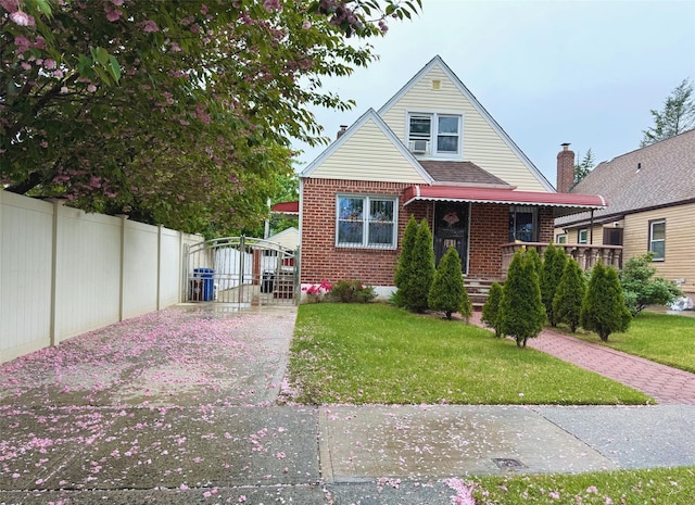 8260 266th St, Glen Oaks, NY 11004 - bungalow-style house featuring covered porch and brick siding