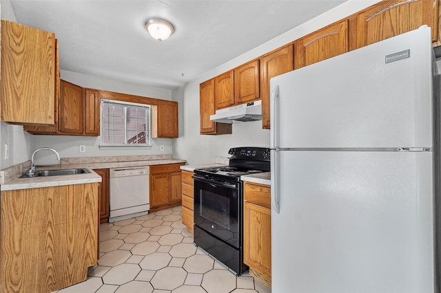 311 Fox Run Ln, Carmel, NY 10512 - kitchen with white appliances, under cabinet range hood, a sink, light countertops, and brown cabinets