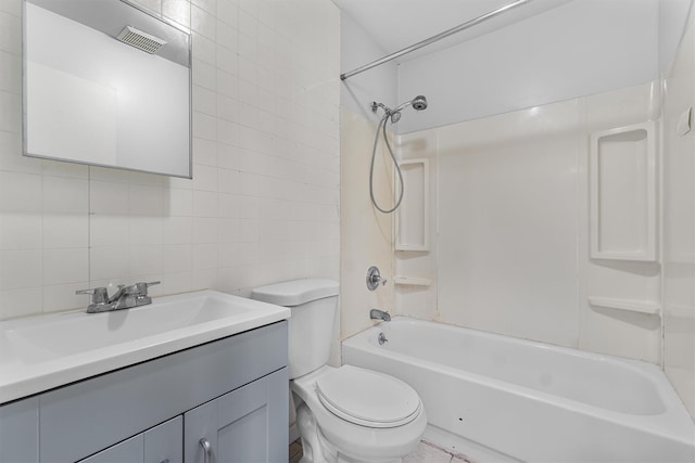 311 Fox Run Ln, Carmel, NY 10512 - full bath featuring tile walls, toilet, vanity, backsplash, and shower / bathtub combination
