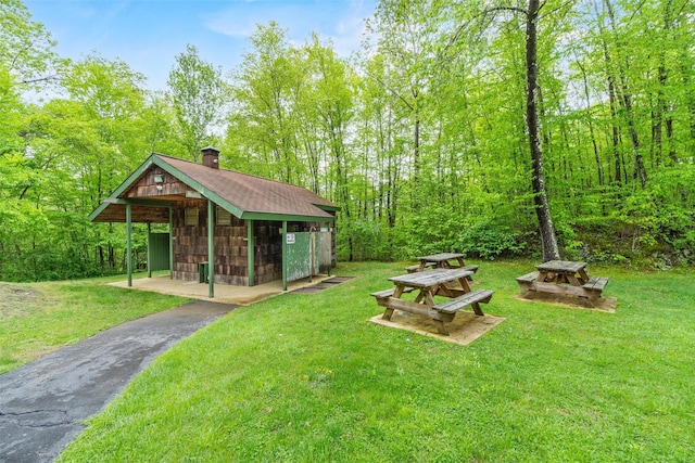 311 Fox Run Ln, Carmel, NY 10512 - view of green lawn with driveway and an outdoor structure