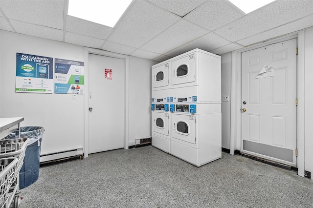 311 Fox Run Ln, Carmel, NY 10512 - shared laundry room with stacked washer / dryer, a baseboard radiator, and washer and clothes dryer