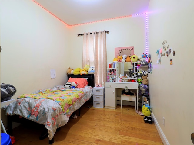bedroom featuring wood finished floors